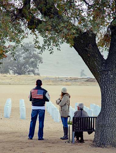 people three person in front of armless chairs during daytime human