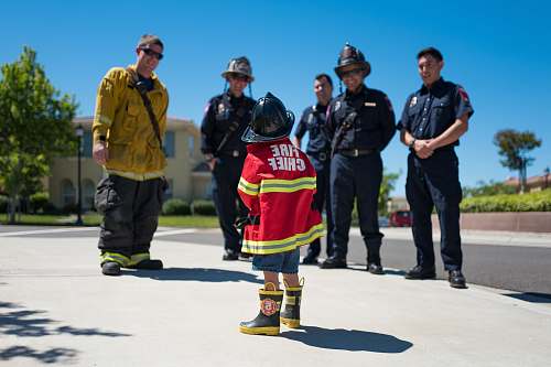 people toddler wearing red firefighter uniform human