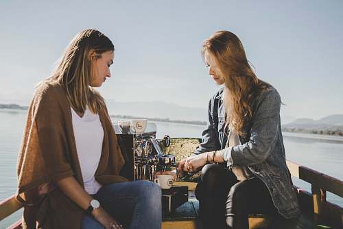 people two women on boat with espresso machine at sea human