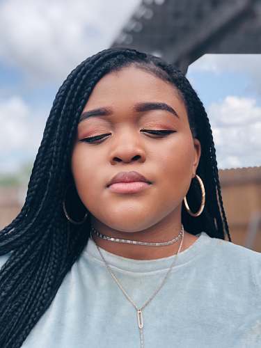 human woman close her eyes while taking selfie people