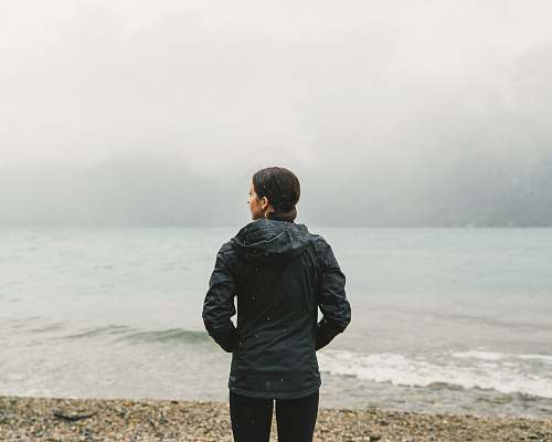 people woman facing body of water human