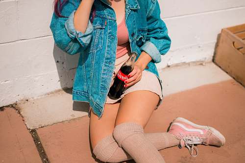 people woman holding Coca-Cola bottle human