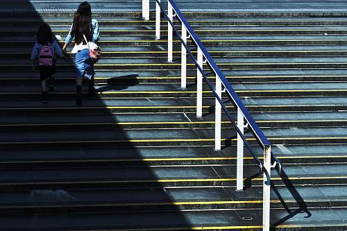 people woman holding girl walking on stairs human