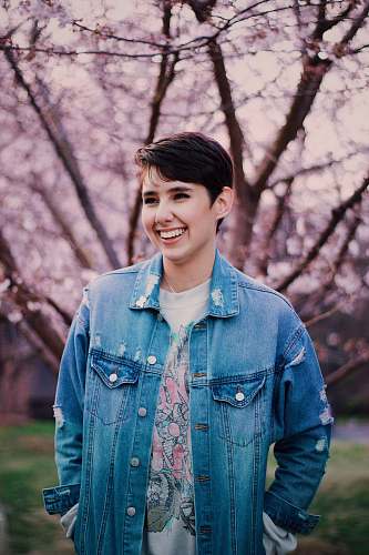 human woman in blue denim jacket smiling people