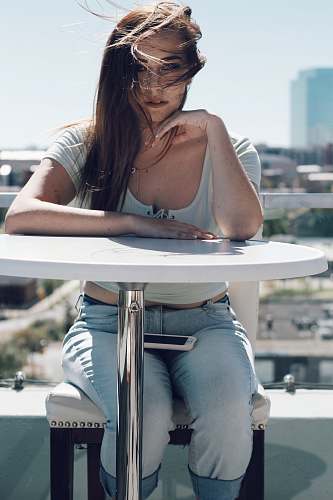 human woman in gray scoop-neck shirt and blue jeans people