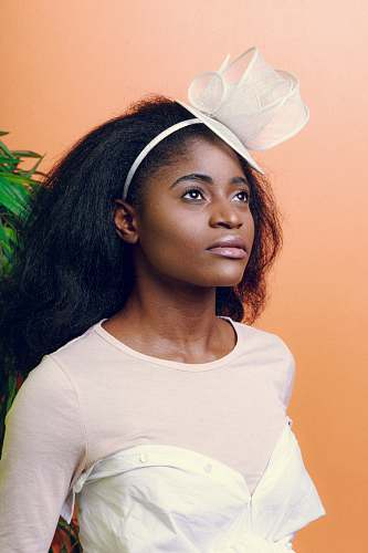human woman in white top looking up people
