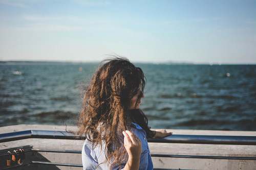 human woman leaning on balcony people