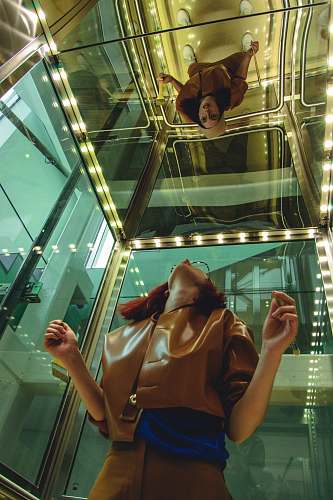people woman looking at mirror human