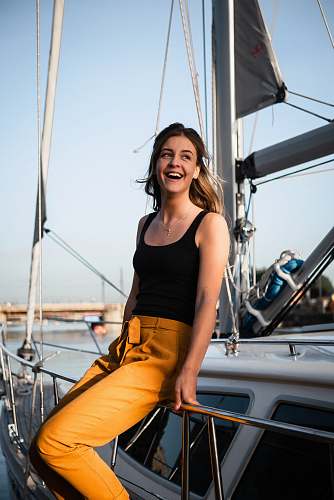 people woman sitting on white yacht human