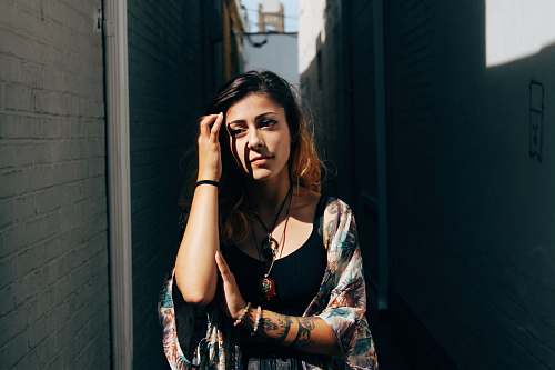 people woman standing between walls tattoo