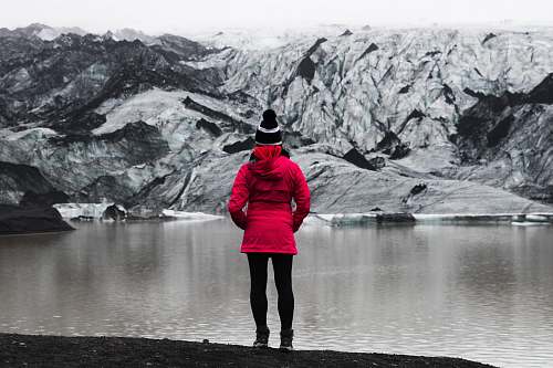 people woman standing in front of mountain covered with snow human