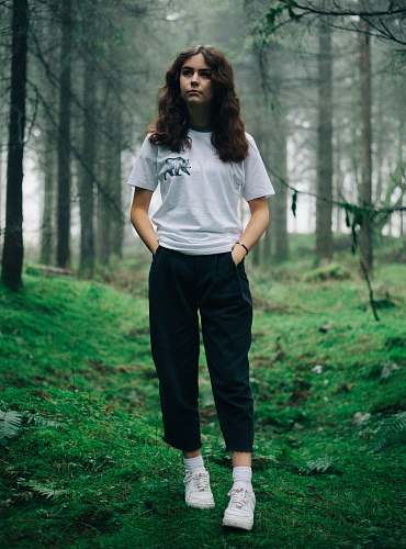 people woman standing in middle of forest human
