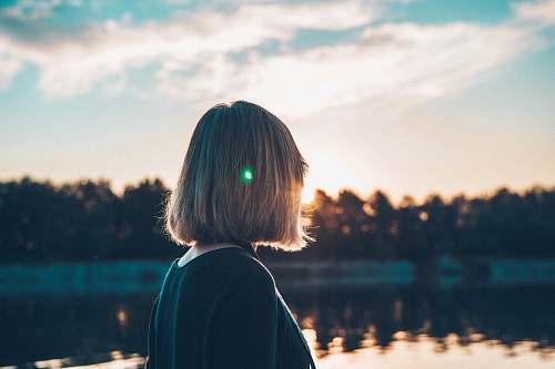 people woman standing near lake during daytime human