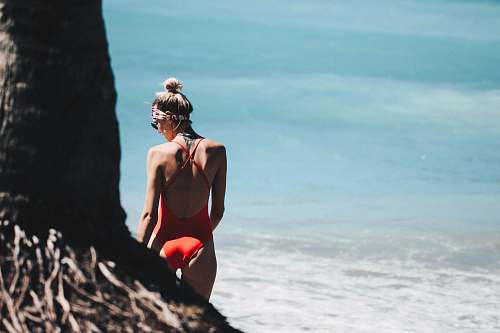 human woman standing near the beach people