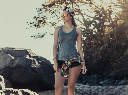 people woman standing on sand during daytime human