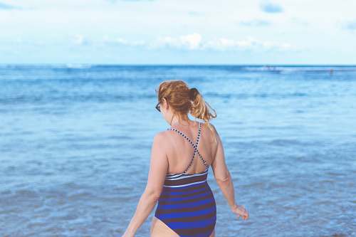 human woman standing on seashore people