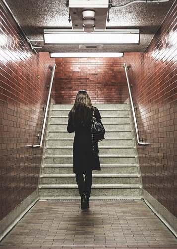 people woman walking near staircase human