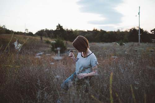 people woman walking on brown leaf plant at daytie human