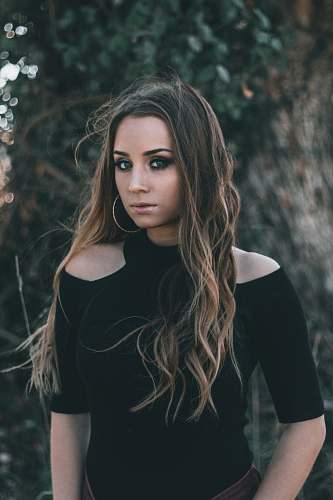 human woman wearing black cold-shoulder blouse people