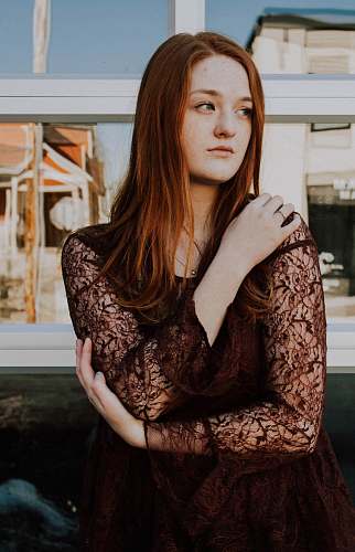 people woman wearing black long-sleeved dress human