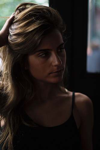 human woman wearing black spaghetti strap top people