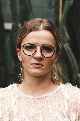 people woman wearing eyeglasses and white lace top glasses