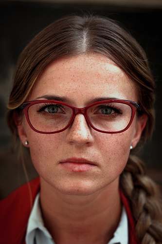 people woman wearing eyeglasses with red frames glasses