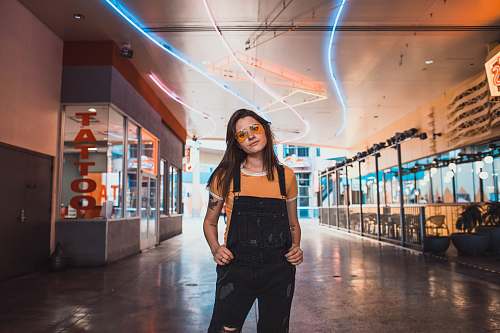 human woman wearing overalls and sunglasses people