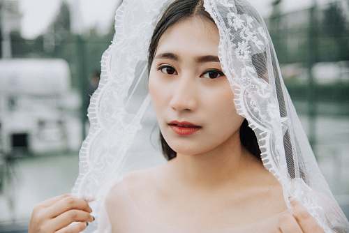 human woman wearing wedding veil during daytime people