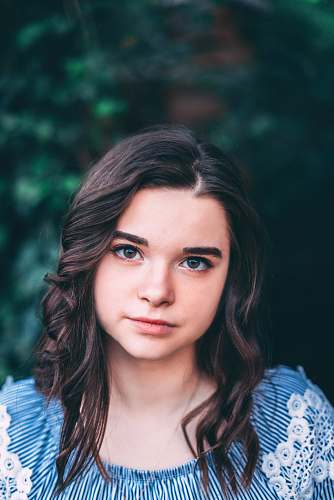 human woman wearing white and blue top people