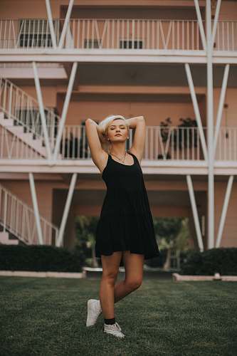human women's black spaghetti strap dress people