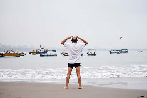 clothing man standing on seashore shorts