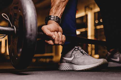 footwear person about to lift barbell clothing