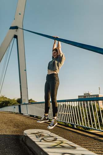 clothing woman hanged on metal bar in the bridge footwear