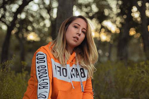 clothing woman in orange hoodie sweater