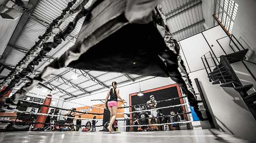 sport woman standing on boxing ring girl