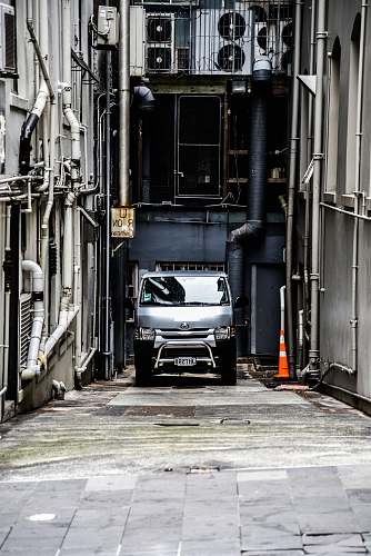 automobile parked gray vehicle in corner car