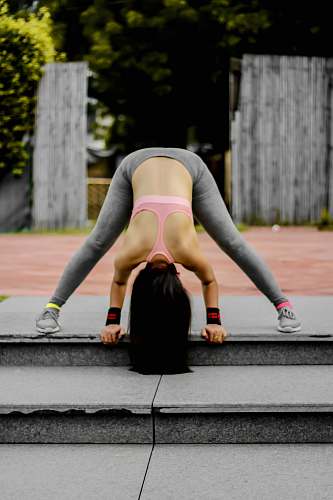 apparel woman doing exercise on gray stairs shoe