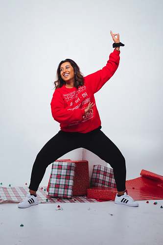 apparel woman in red crew-neck long-sleeved shirt sleeve
