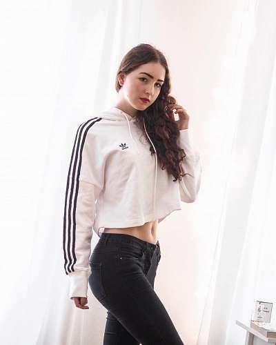 apparel woman wearing white and black adidas jacket standing sleeve
