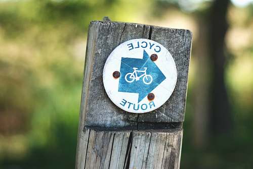bike cycle route sign on a wooden post cycling