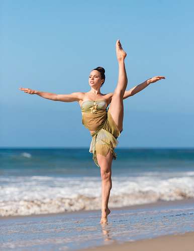 beach woman dancing in seashore ocean