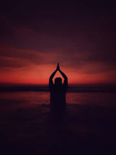 sports person performing yoga position working out