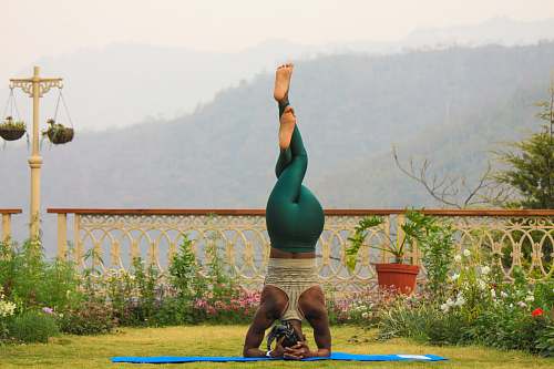 person woman doing fitness headstand human
