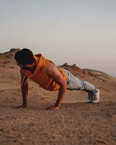 human man pushes up on ground person