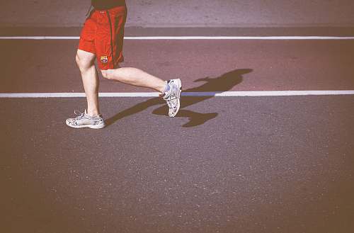 person person running on concrete road human