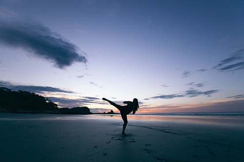 beach silhouette of person kicking on mid air nicaragua