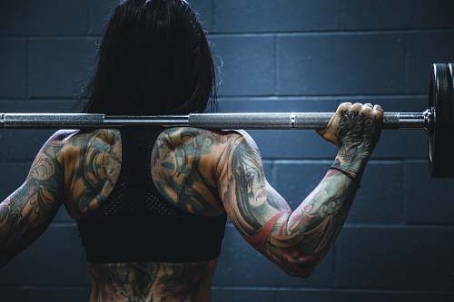 tattoo woman carrying barbell ornament