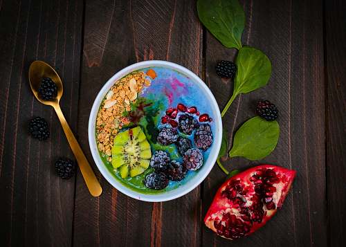 bowl mixed fruits on bowl with blueberry on top healthy