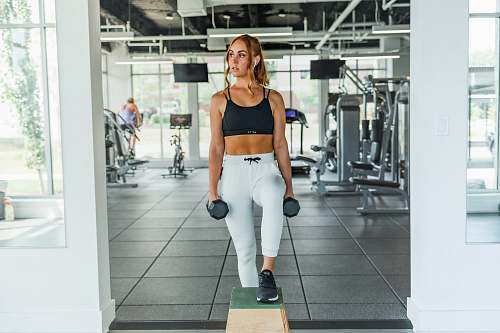 apparel woman carries dumbbells clothing